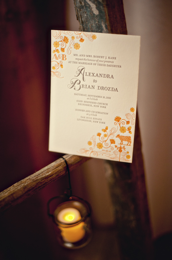 detail of a orange and yellow wedding program - hanging candle - wedding photo by top Atlanta based wedding photographers Scobey Photography